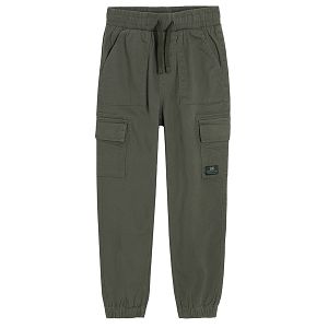Khaki trousers with external side pockets and adjustable waist