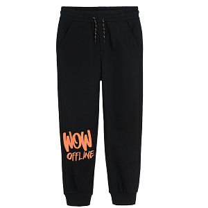 Black jogging pants with print on one knee