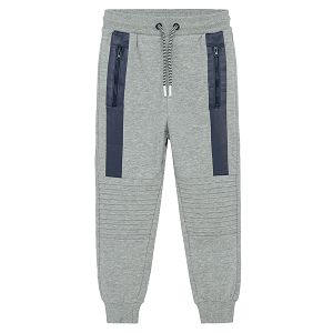 Grey jogging pants with blue stripes