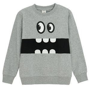 Grey sweatshirt with a monster face pattern