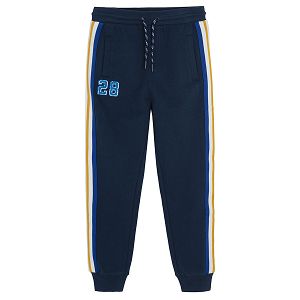 Dark blue jogging pants with yellow, white and blue stripe on the side
