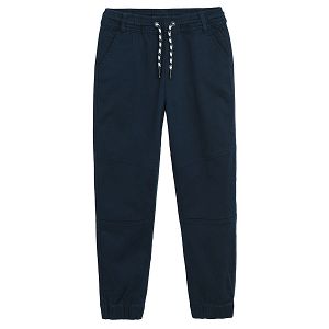 Blue trousers with adjustable waist and elastic around the ankles