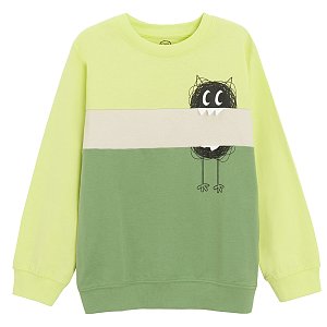 Green sweatshirt with funny creature