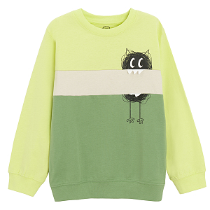 Green sweatshirt with funny creature