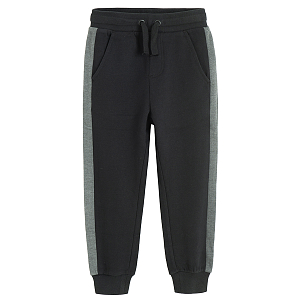 Black sweatpants with grey strip on the side