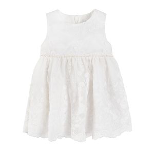 White sleeveless lace dress and flower patterns