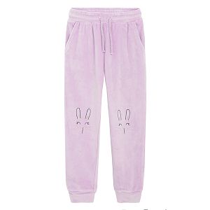 Purple jogging pants with bunny faces on the knees