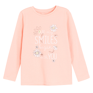 Pink long sleeve blouse with SMILES BEGIN WITH YOU and daisies print