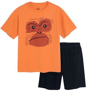 Orange short sleeve T-shirt with gorilla print and black shorts pyjamas