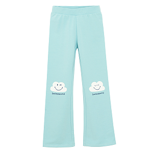 Light blue wide leg pants with daisies print on the knees