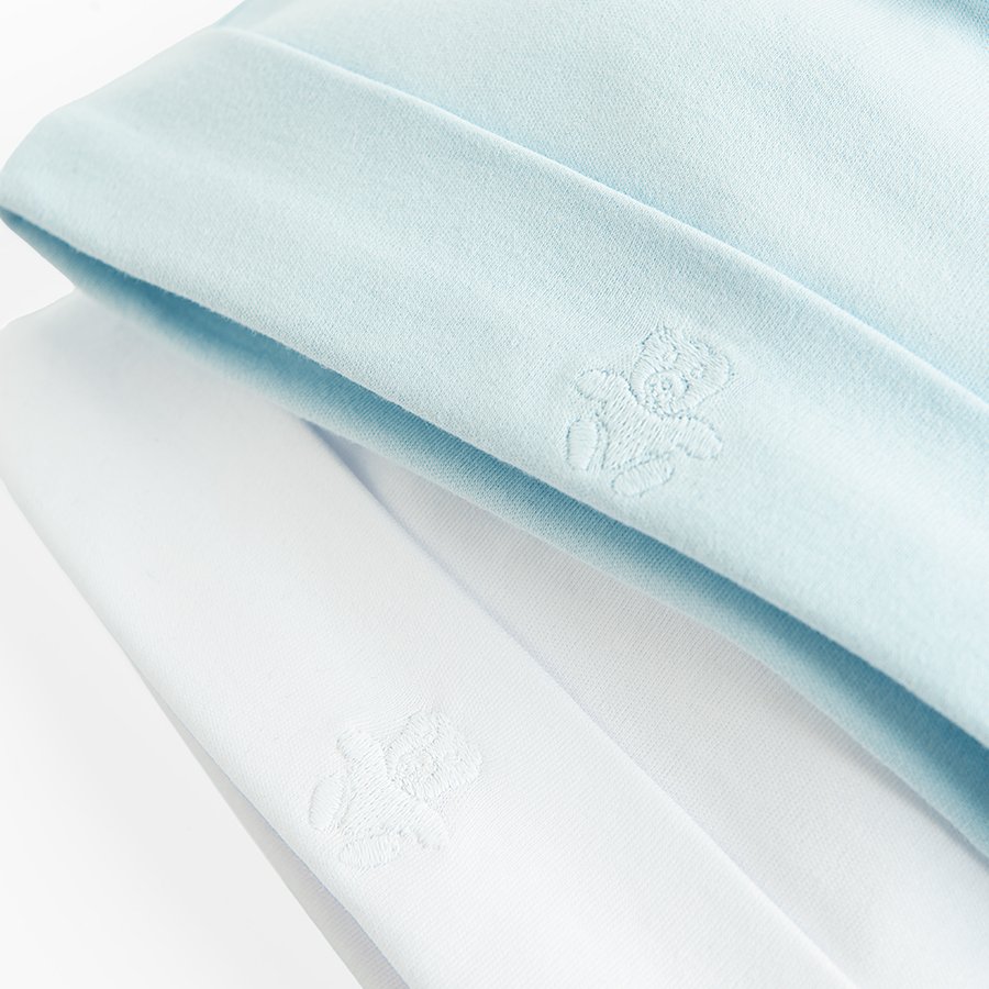 White and light blue caps from organic cottion- 2 pack