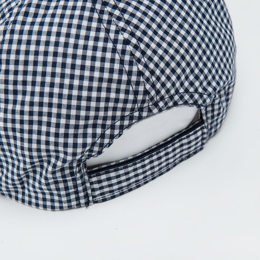 White and blue checked cap