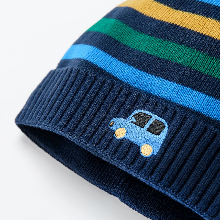 Striped cap with pom pom