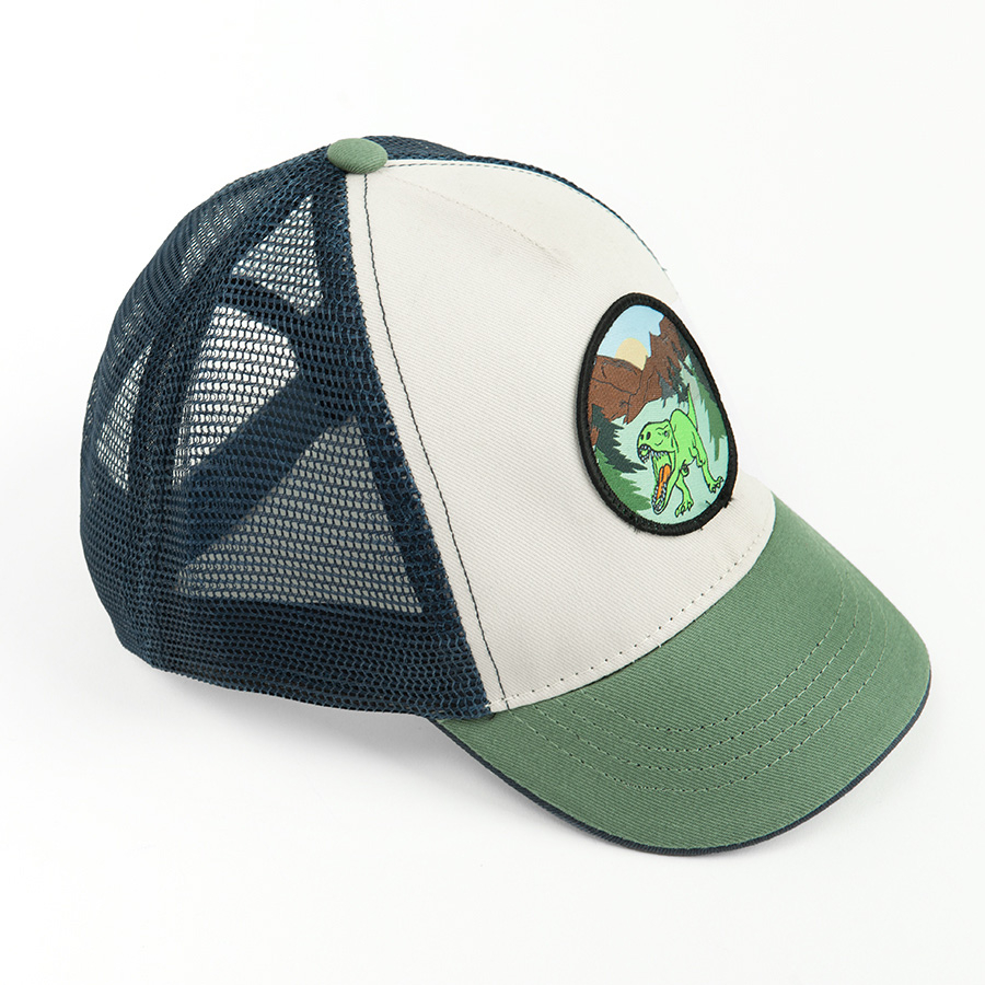 White and green jockey hat with dinosaur print