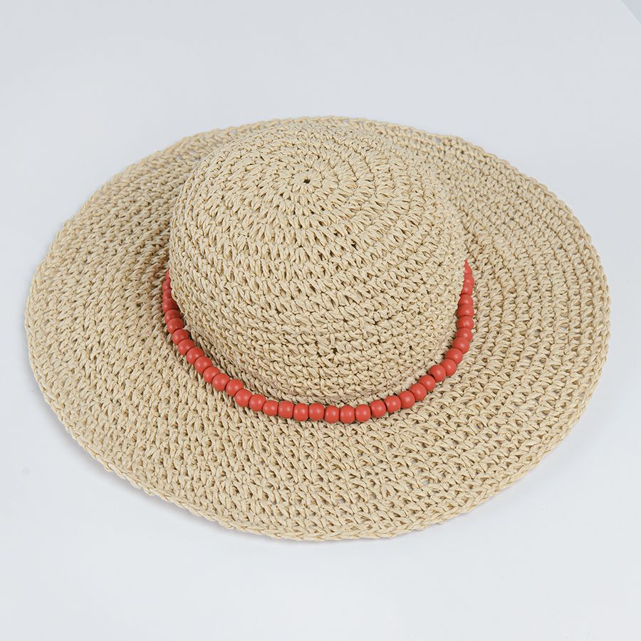 Light beige brimmed Panama hat with coral beads
