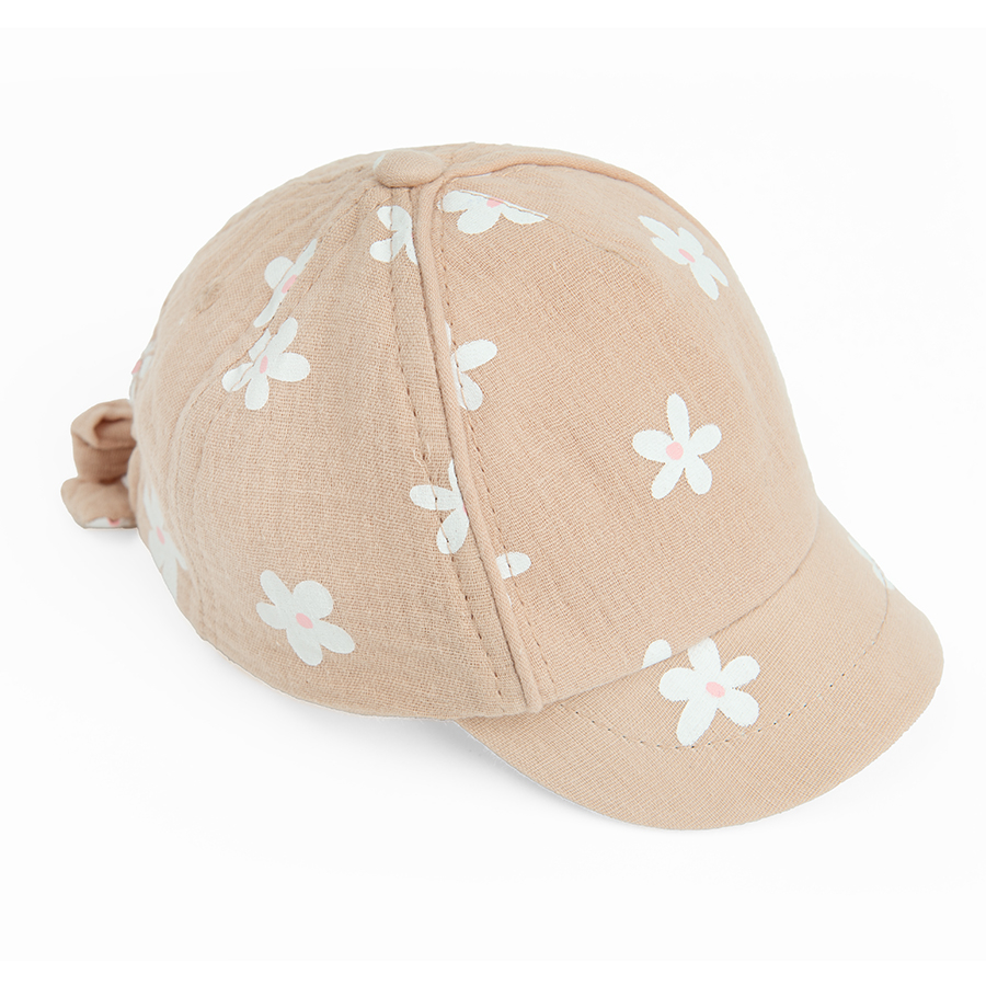 Ligh pink jockey hat with daisies print and bow on the back