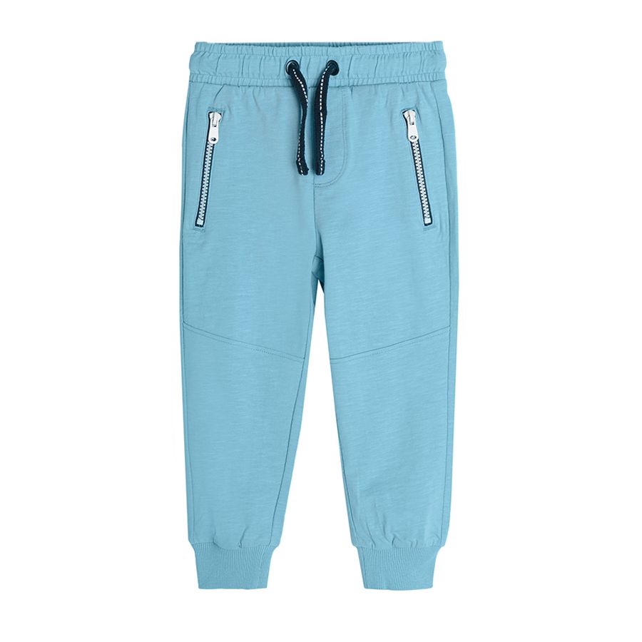 Blue jogging pants with cord and pockets with zipper