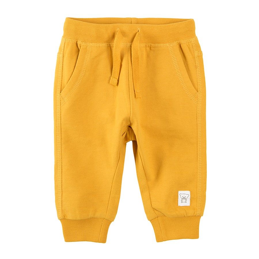 Yellow jogging pants with cord and side pockets