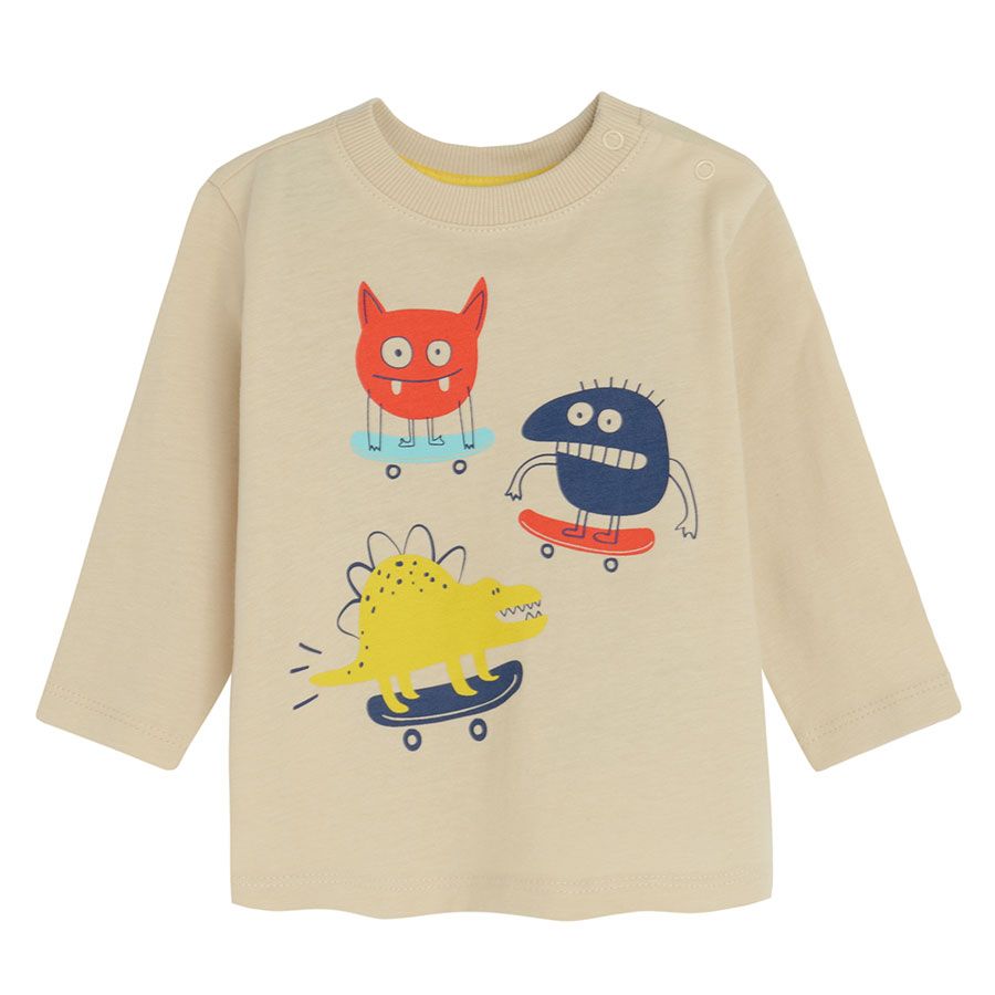 White long sleeve blouse with cute monsters print