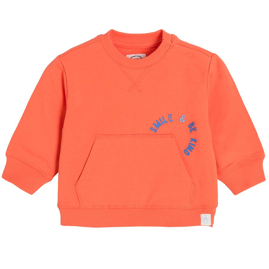Orange sweatshirt with pockets on the front
