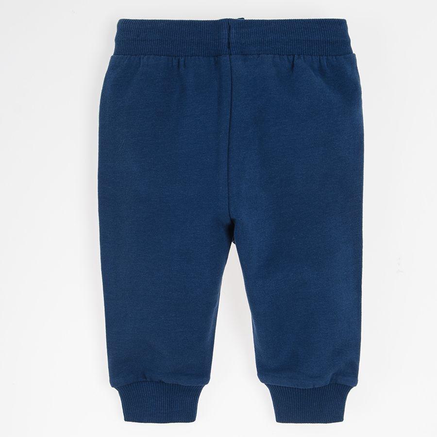 Navy blue jogging pants with pockets on the front and adjustable waist
