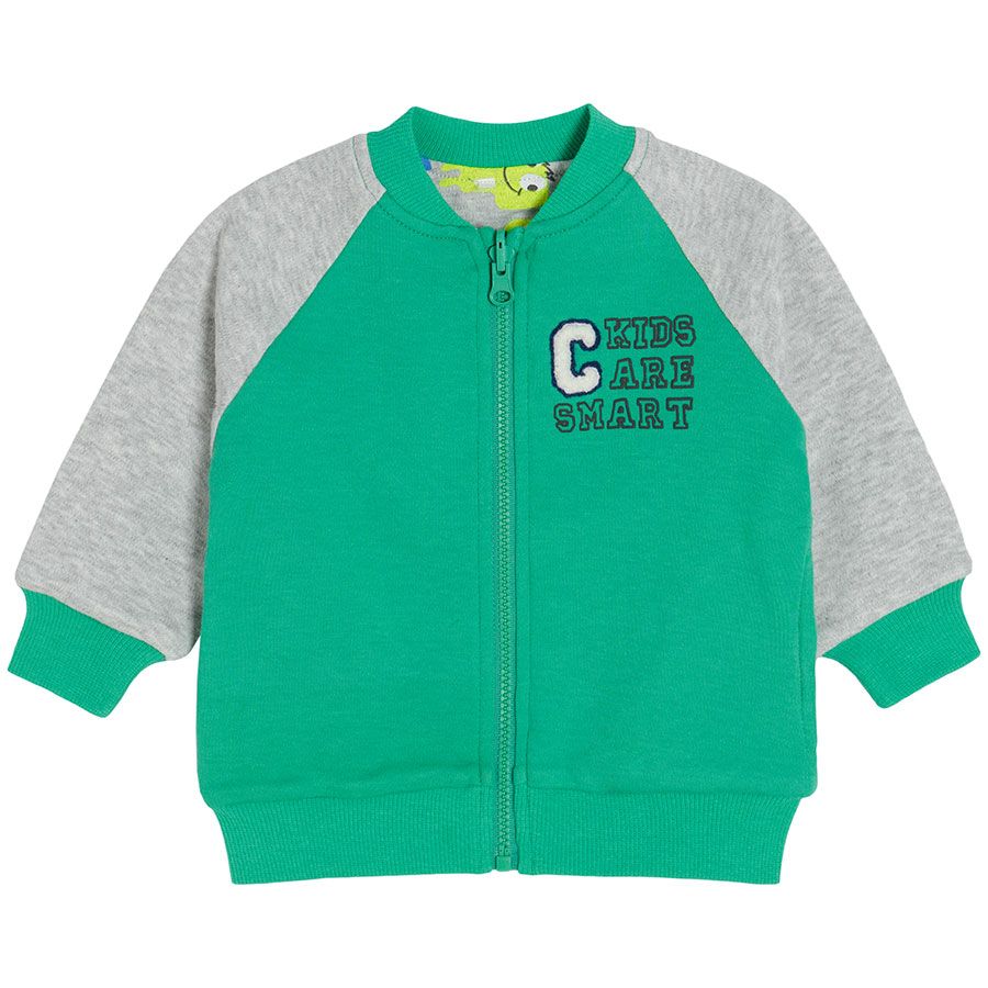 Green zip through hooded sweatshirt with animals print on the inside lining