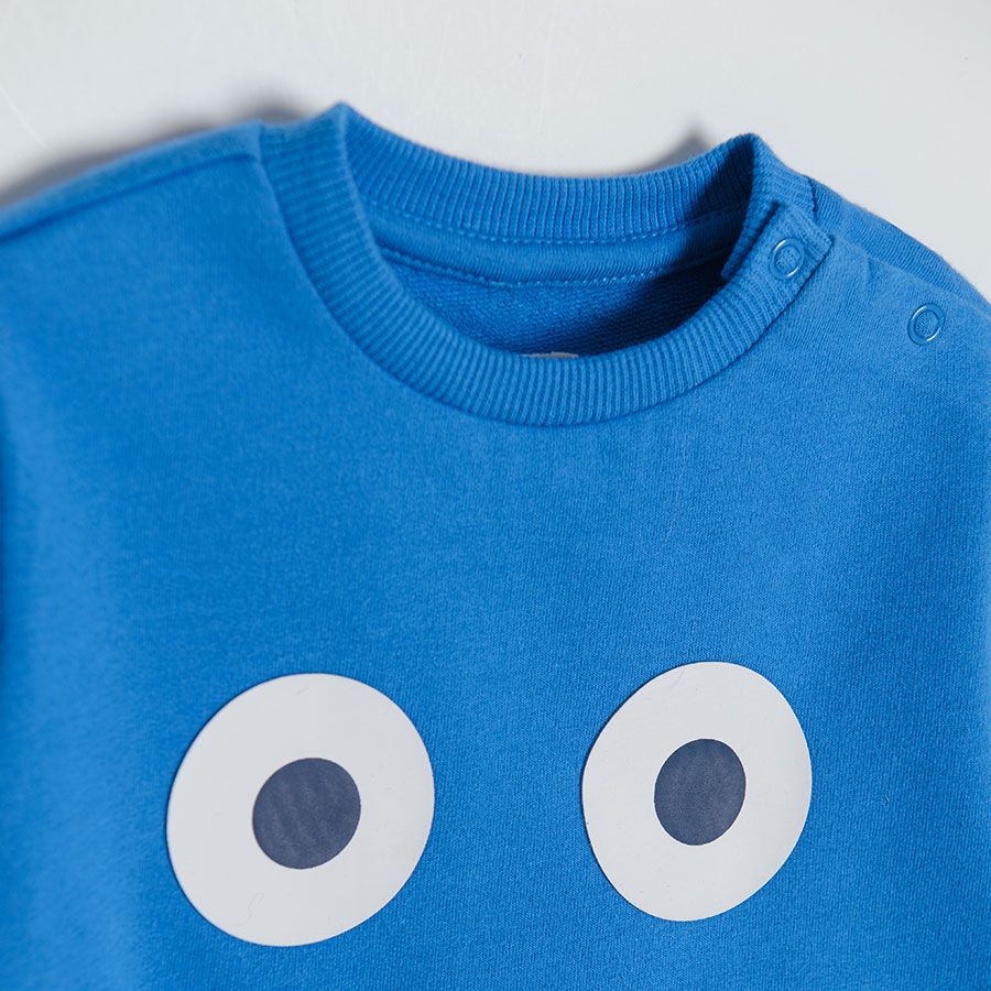 Blue sweatshirt with happy face