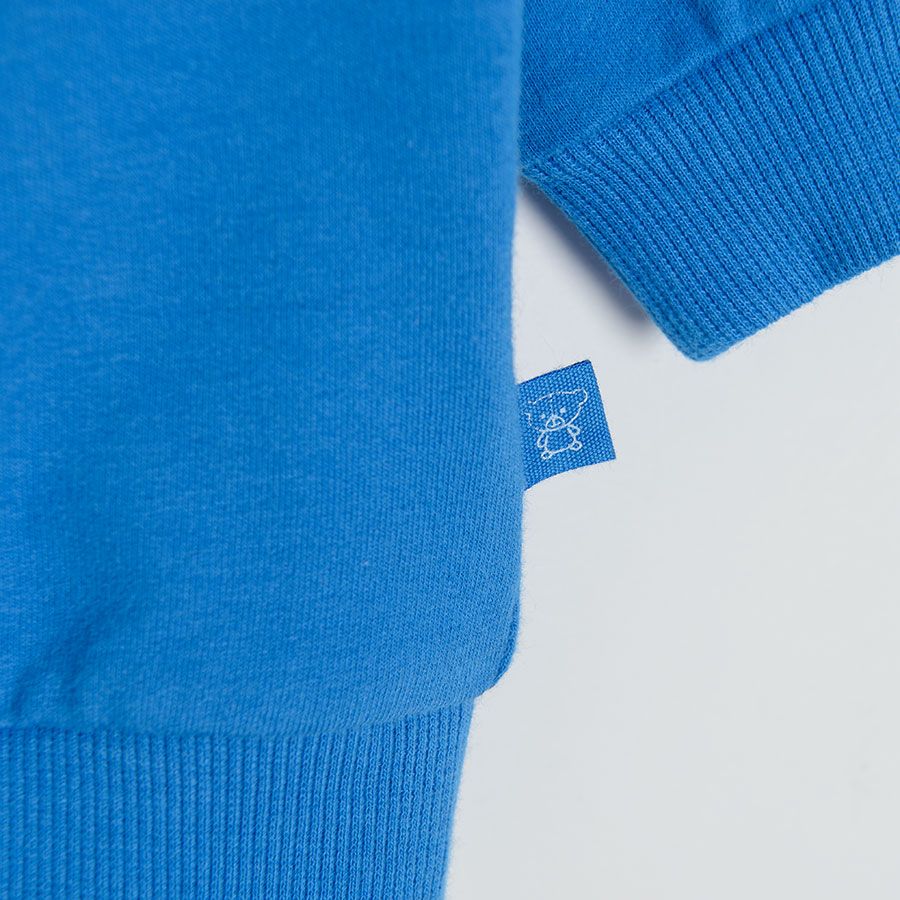 Blue sweatshirt with happy face