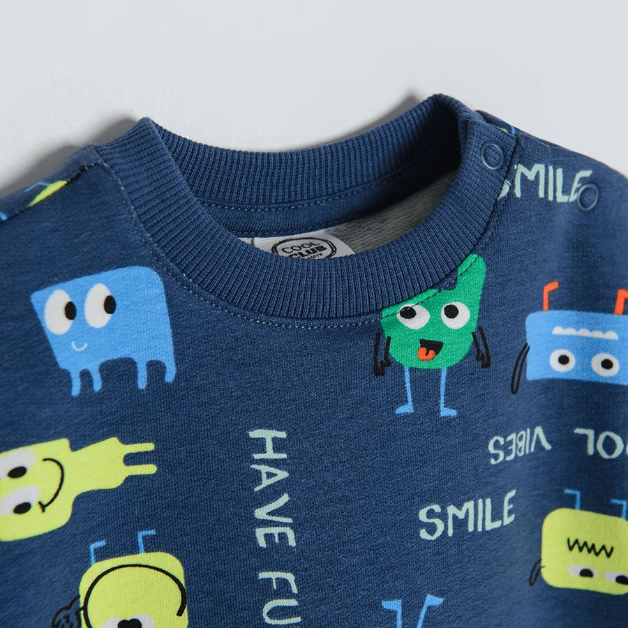 Navy blue sweatshirt with happy smiley creatures