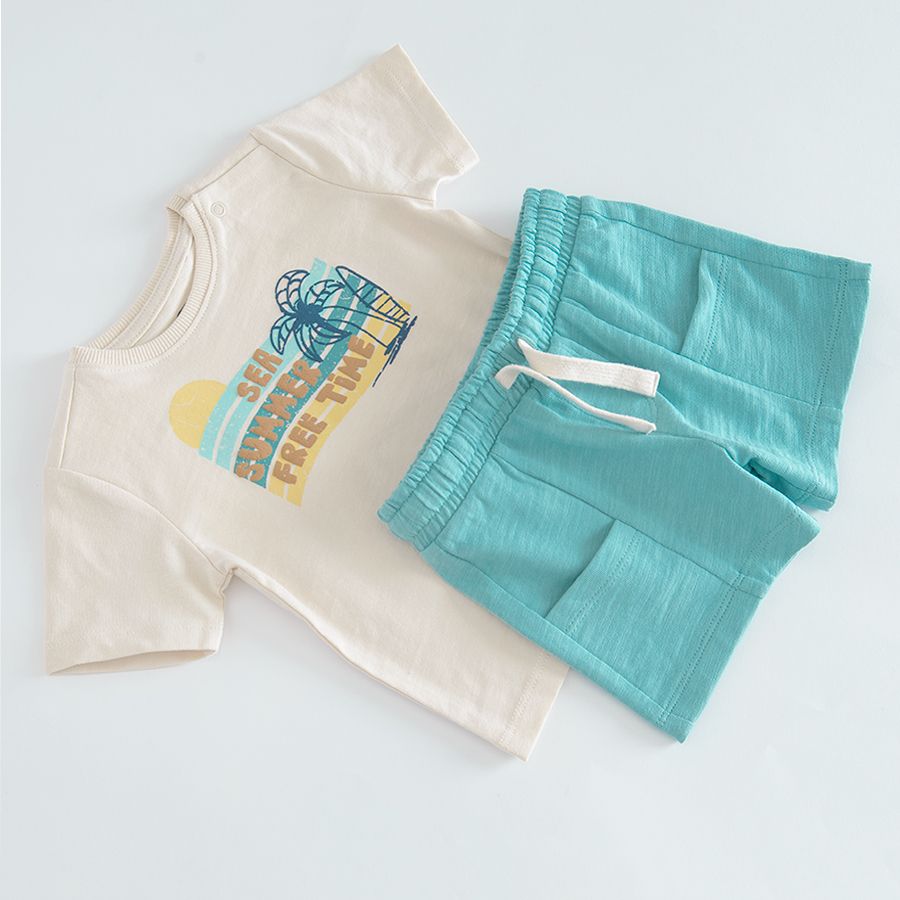 Beige short sleeve T-shirt with SEA SUMMER FREE TIME print and blue shorts with back pocket