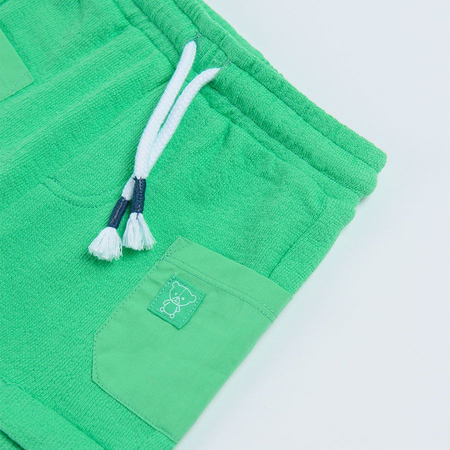 Green pants with adjustable waist and pockets