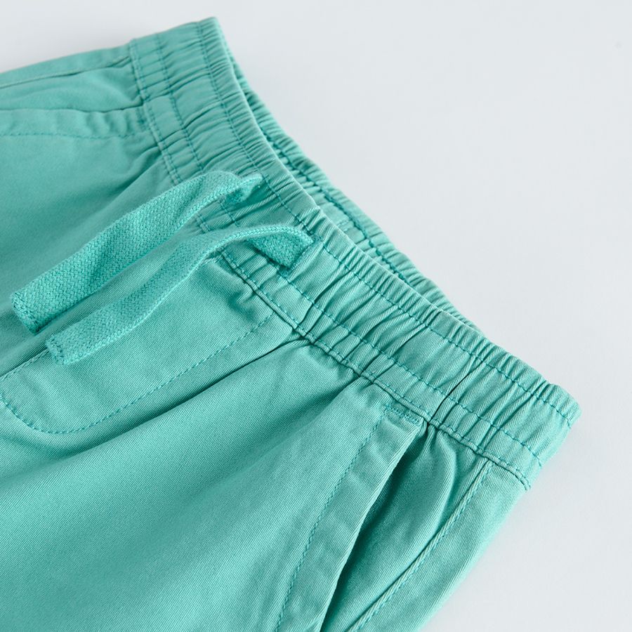 Turquoise trousers with adjustable waist