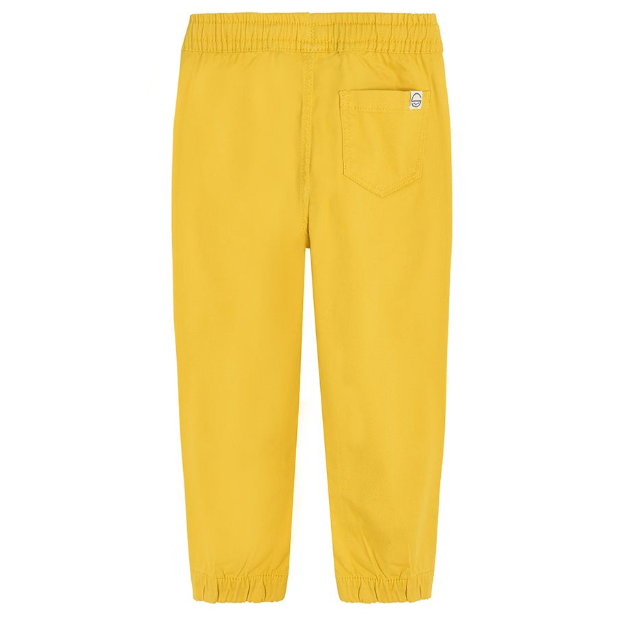 Yellow trousers with adjustable waist