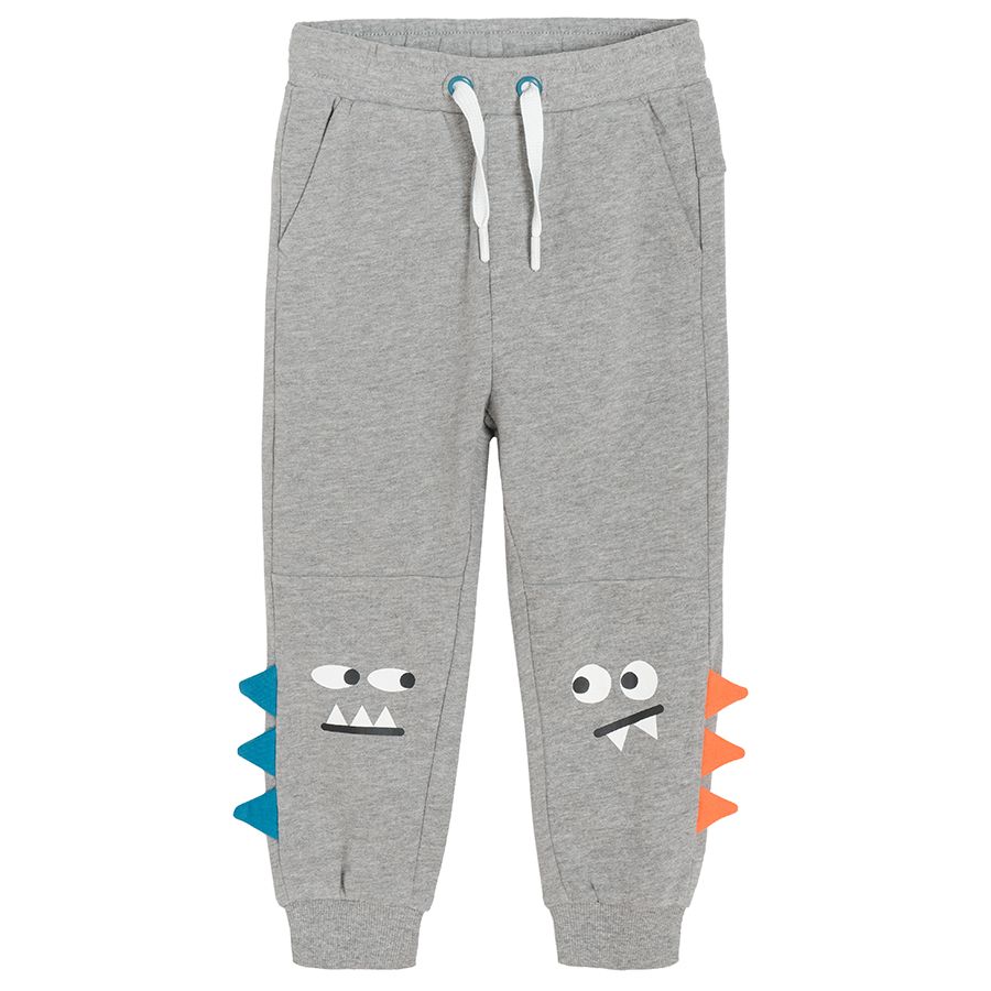 Grey melange jogging pants with dinosaur scales on the side and adjustable waist