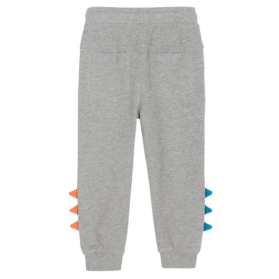 Grey melange jogging pants with dinosaur scales on the side and adjustable waist