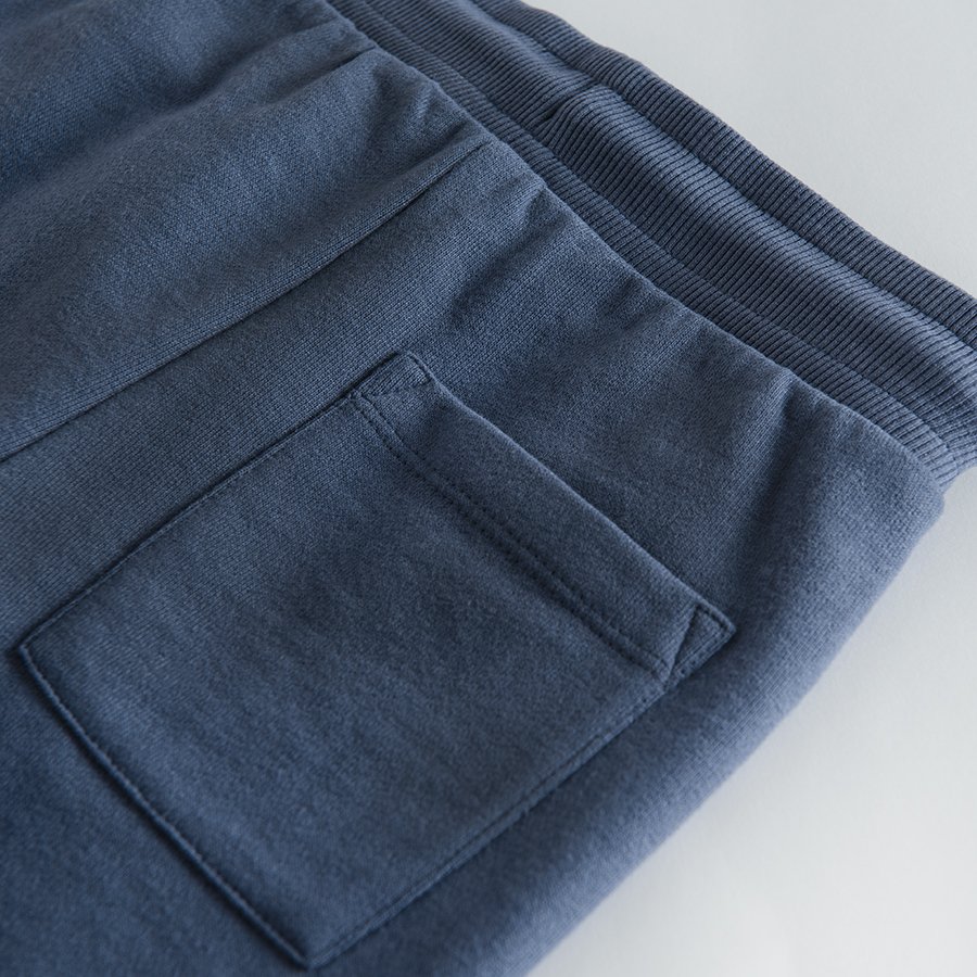 Blue jogging pants with adjustable waist