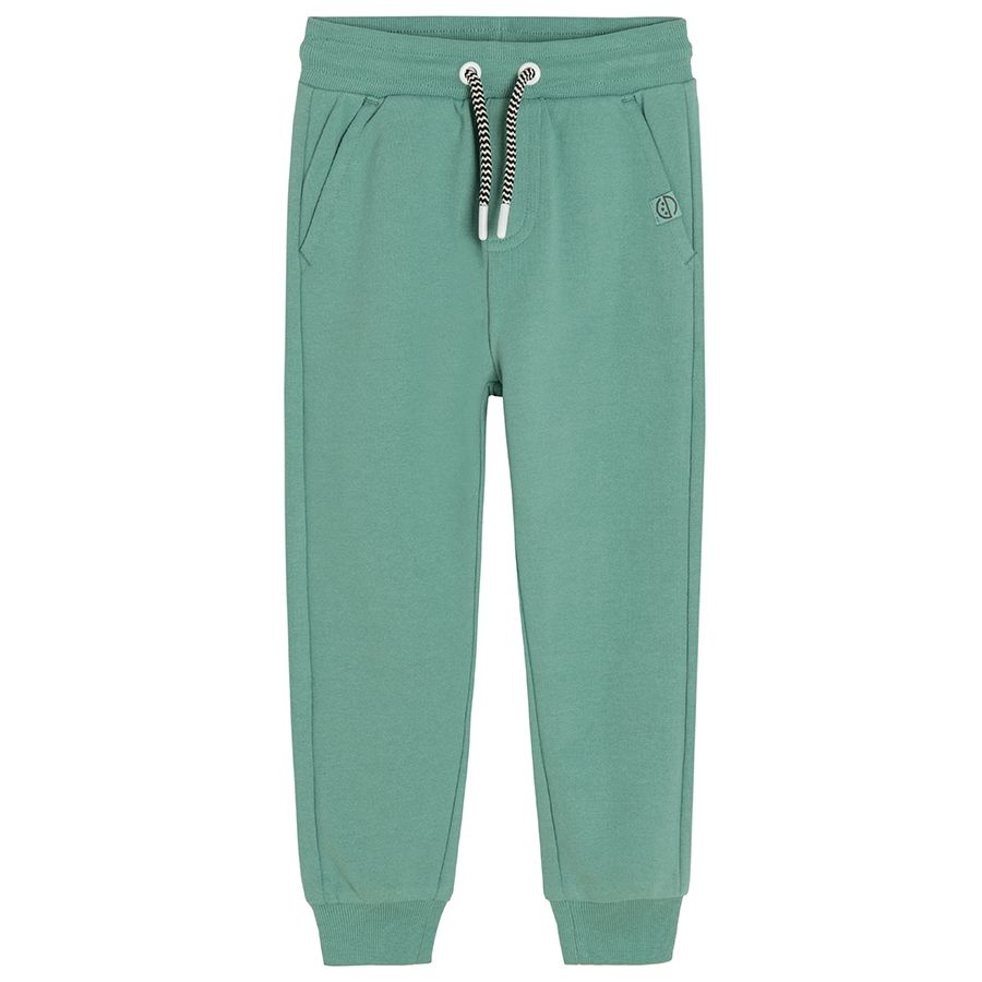 Green set of sweatshirt and jogging pants with adjustable waist