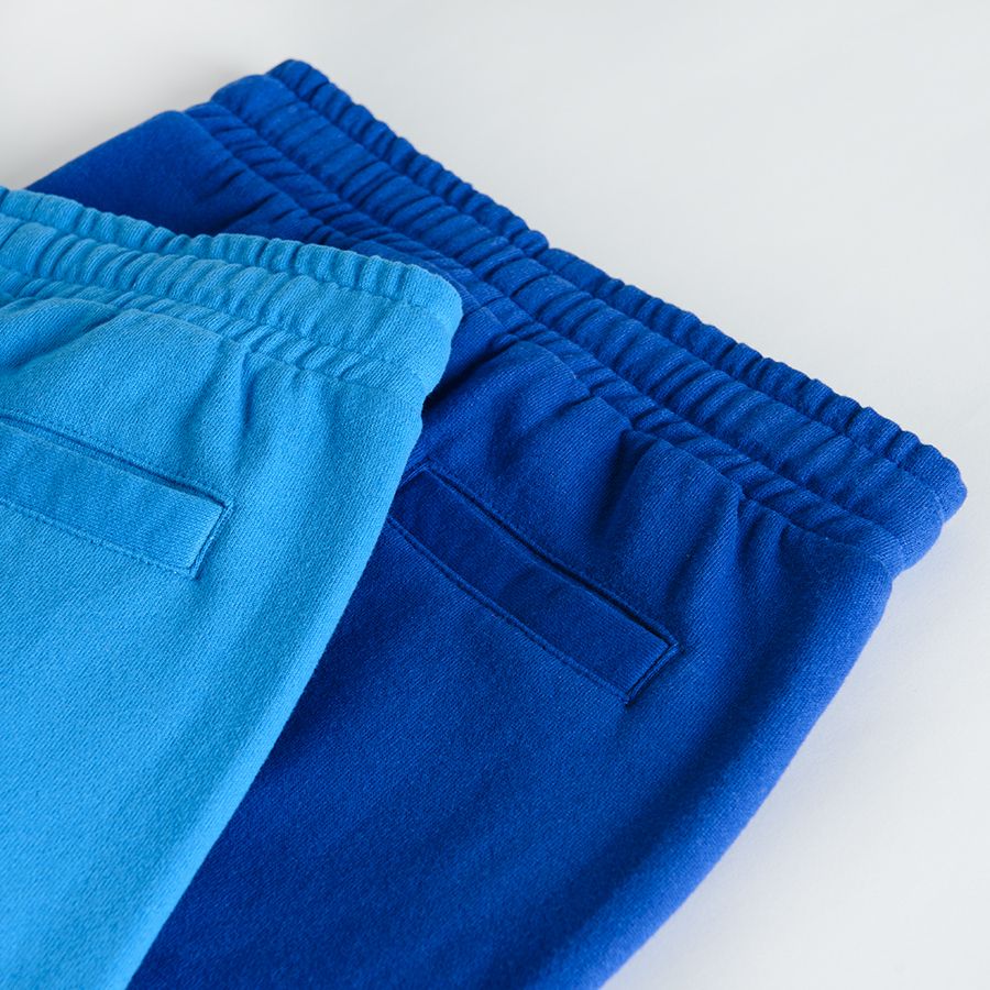Φόρμα 2 τμχ μπλε γαλάζιο με στάμπα τερατάκι στα γόνατα