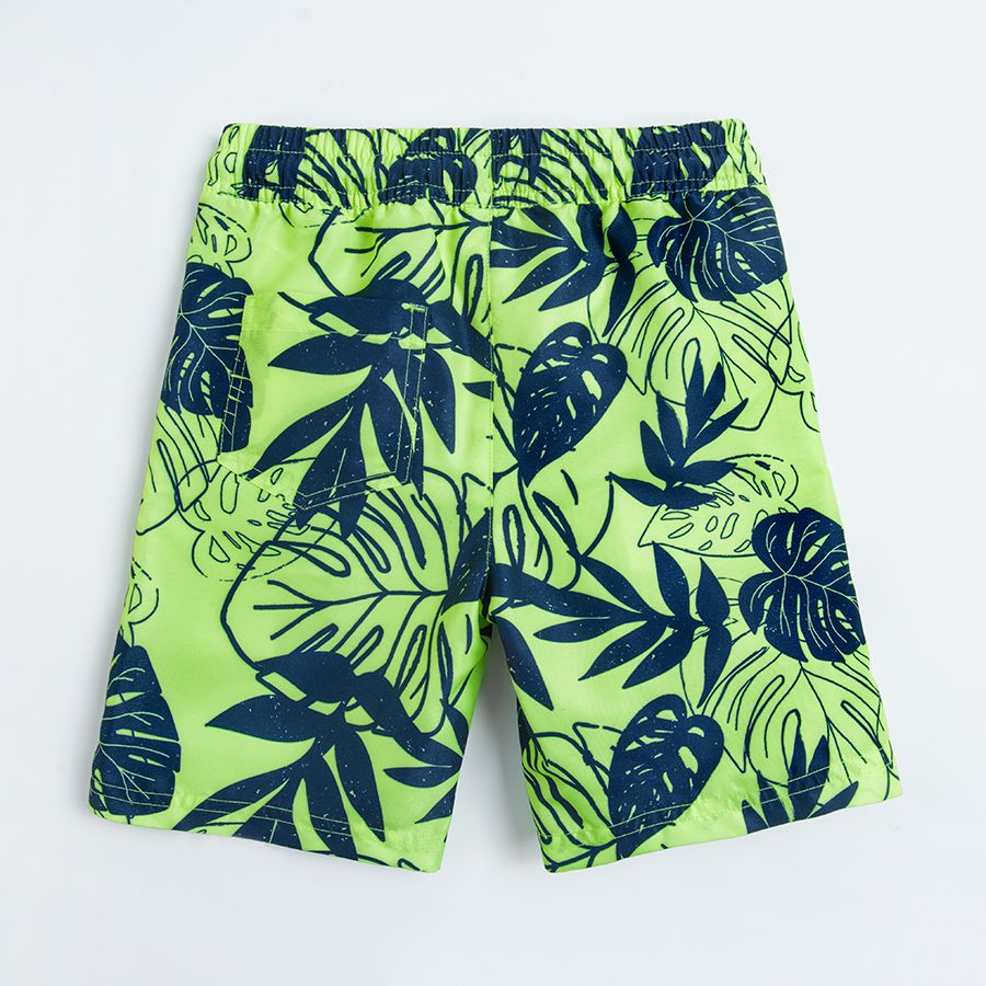Turquoise swimming shorts with tropical leaves print