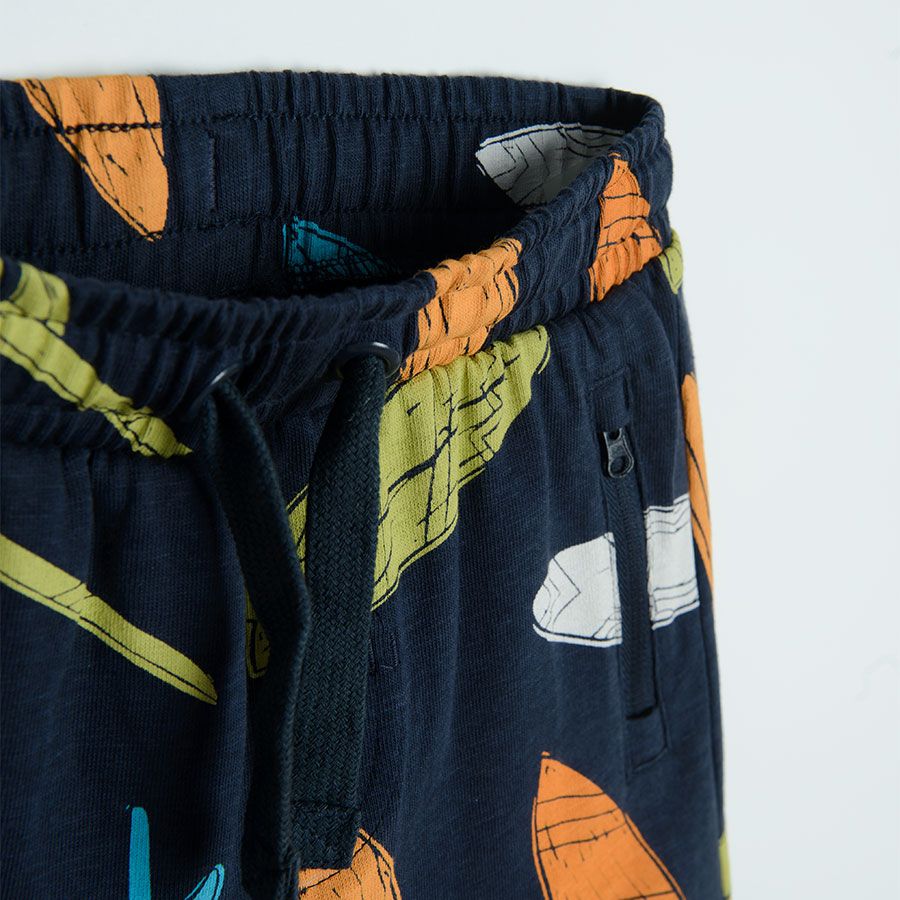 Blue shorts with surf boards print