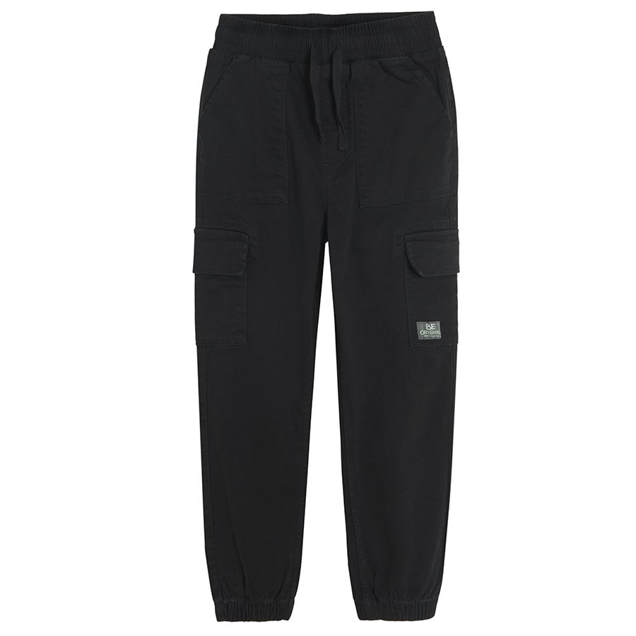 Black trousers with external side pockets and adjustable waist