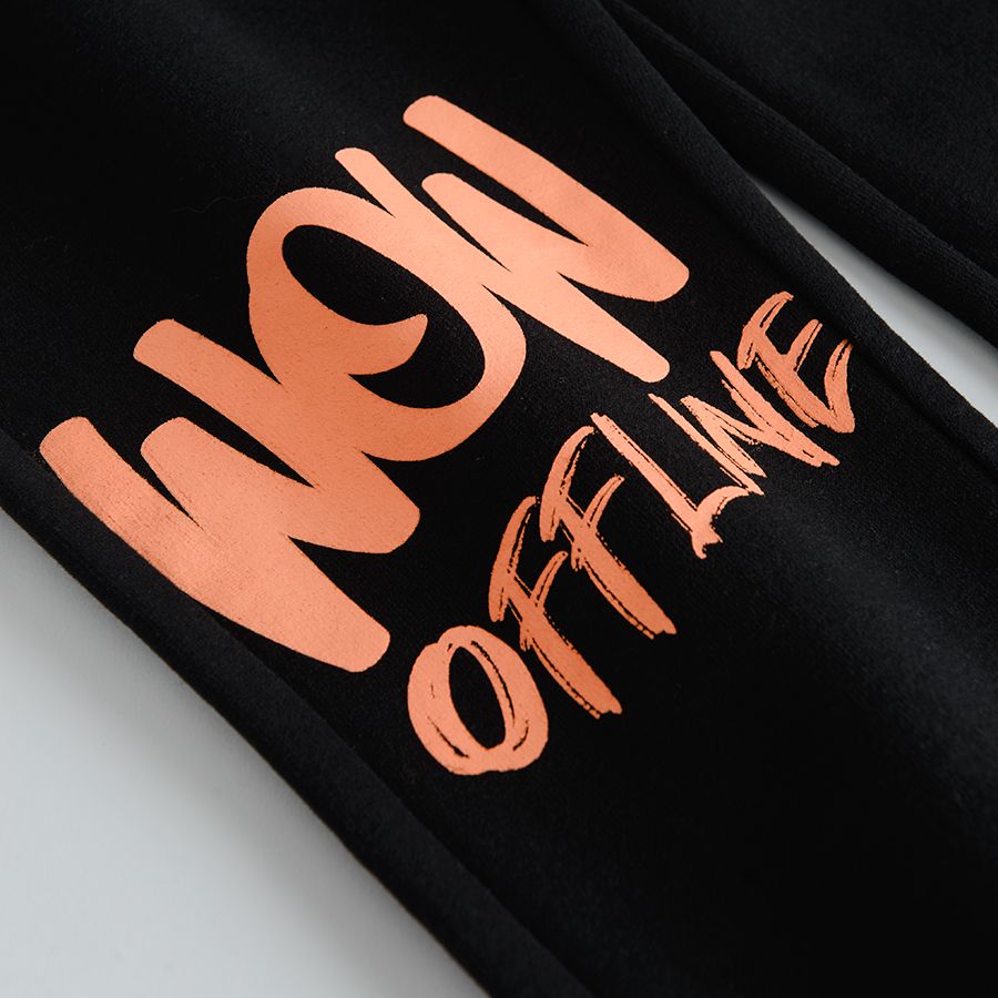Black jogging pants with print on one knee