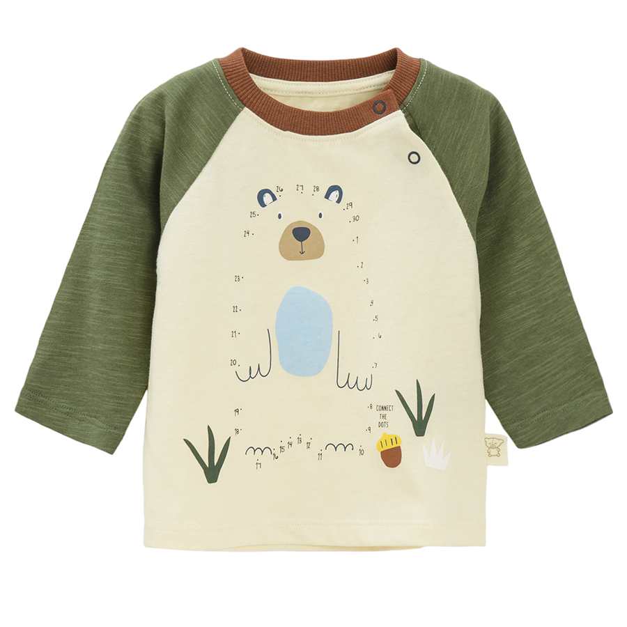 Beige long sleeve blouse with green sleeves and bear print