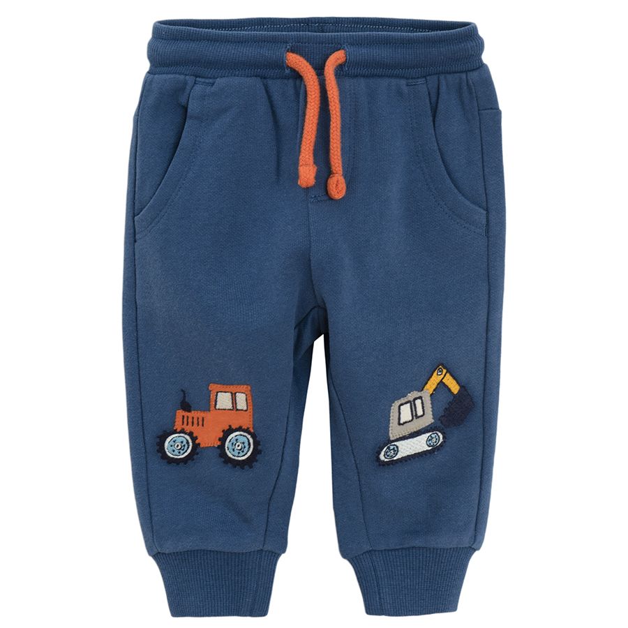Blue jogging pants with trucks print on the knees