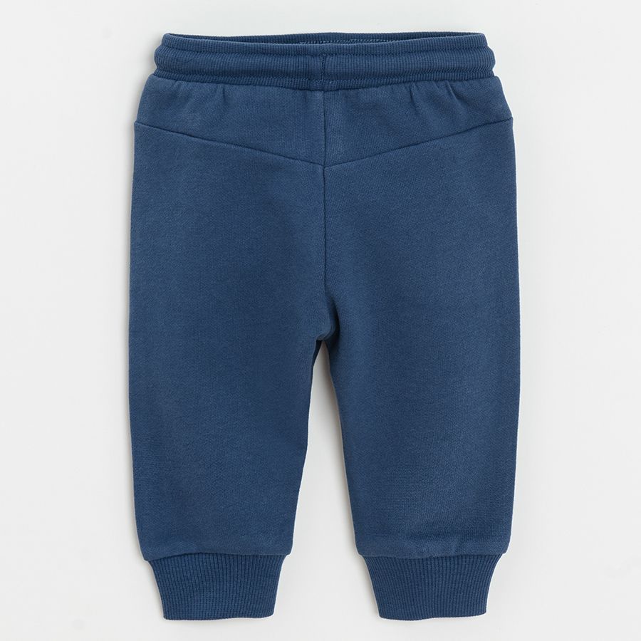 Blue jogging pants with trucks print on the knees