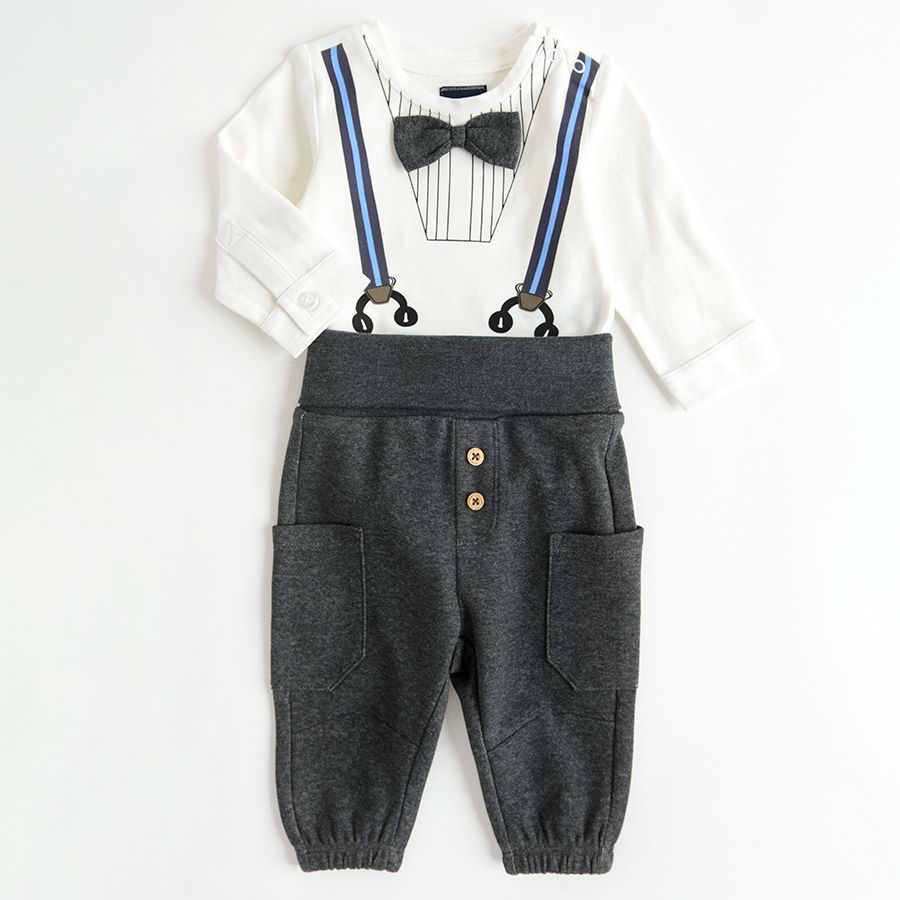 White long sleeve bodysuit with suspenders and bow tie print and grey jogging pants with external pockets