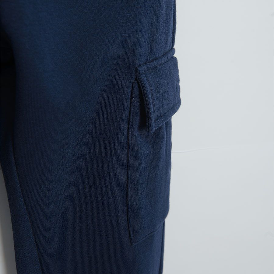 Navy blue jogging pants with side pockets and adjustable waist