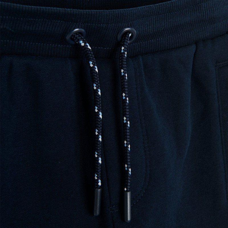 Black jogging pants with light blue, red and white stripe on the side