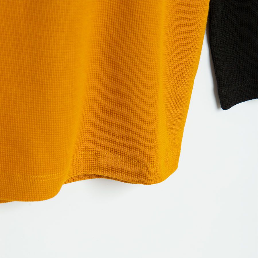 Yellow with black long sleeves and formula1 print