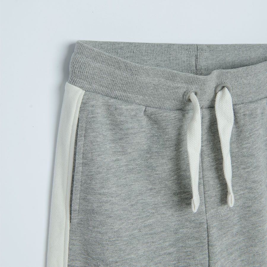 Grey jogging pants with white stripe on the side